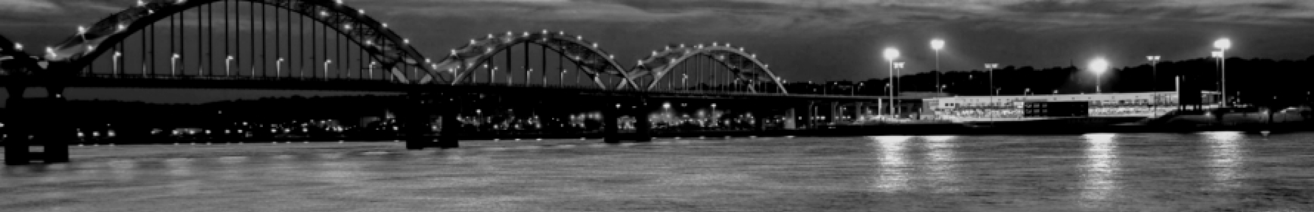 Black and white image of the Centennial bridge over the Mississippi River